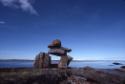 Niungvaliruluit (a window-shaped directional inuksuk for sighting or aligning a location in the…